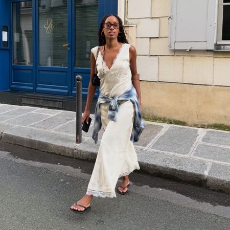 Influencer wearing a casual cream-colored maxi dress