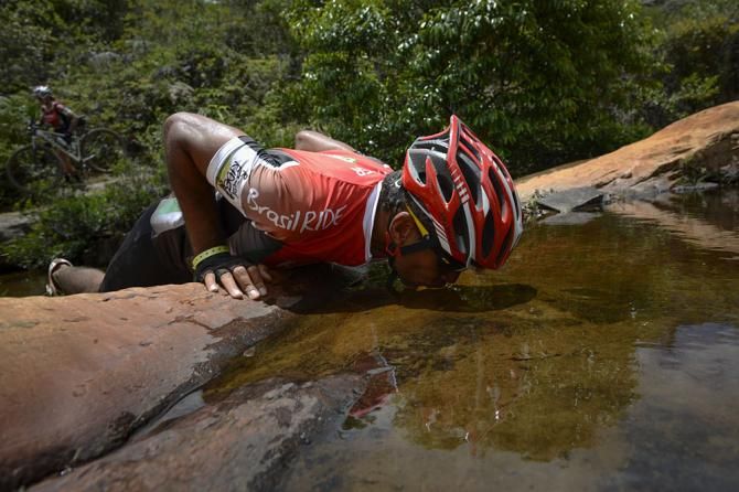 A rider takes a drink