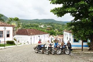 Tire, Motorcycle, House, Neighbourhood, Town, Fender, Automotive tire, Hill station, Rural area, Residential area,