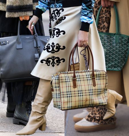 women carrying designer tote bags 