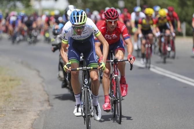 Damien Howson makes an attack followed closely by Will Clarke