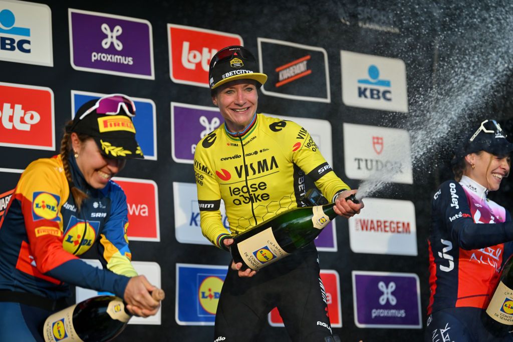 WAREGEM BELGIUM MARCH 27 LR Shirin van Anrooij of The Netherlands and Team Lidl Trek on second place race winner Marianne Vos of The Netherlands and Team VismaLease a Bike and Letizia Paternoster of Italy and Team LivAlUla Jayco on third place celebrate on the podium ceremony after the 12nd Dwars door Vlaanderen 2024 Womens Elite a 1299km one day race from Waregem to Waregem on March 27 2024 in Waregem Belgium Photo by Luc ClaessenGetty Images
