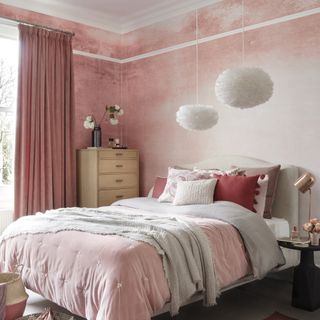 bedroom with pink mottled plaster effect on walls