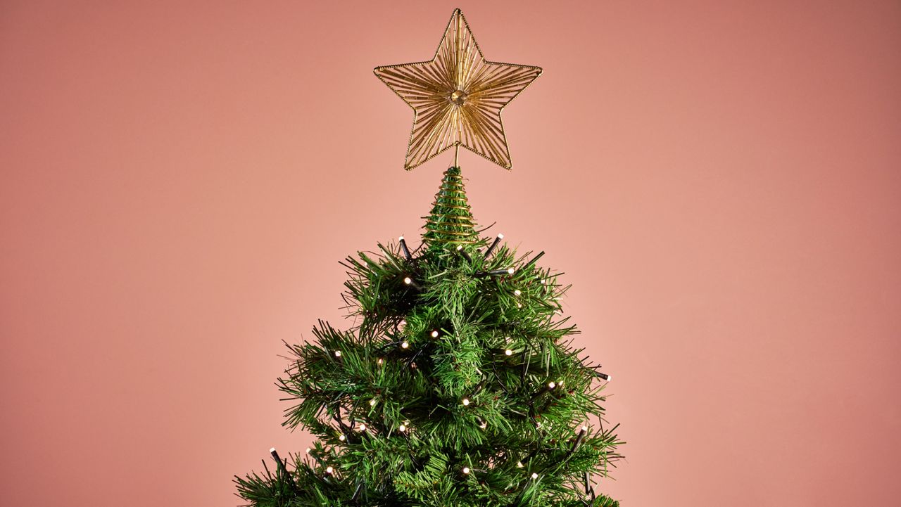 The Nanoleaf Smart Holiday String Lights are glowing white on a Christmas tree.