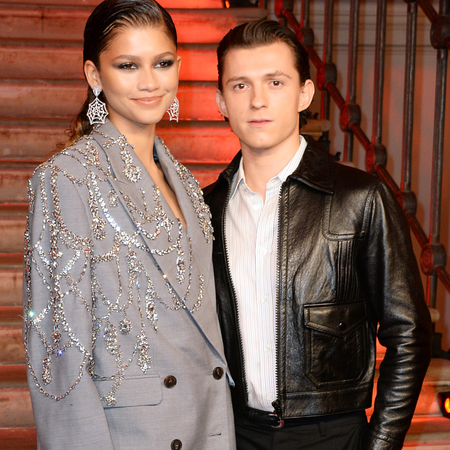 Zendaya and Tom Holland pose at a photocall for "Spider-Man: No Way Home" at The Old Sessions House on December 5, 2021 in London, England.