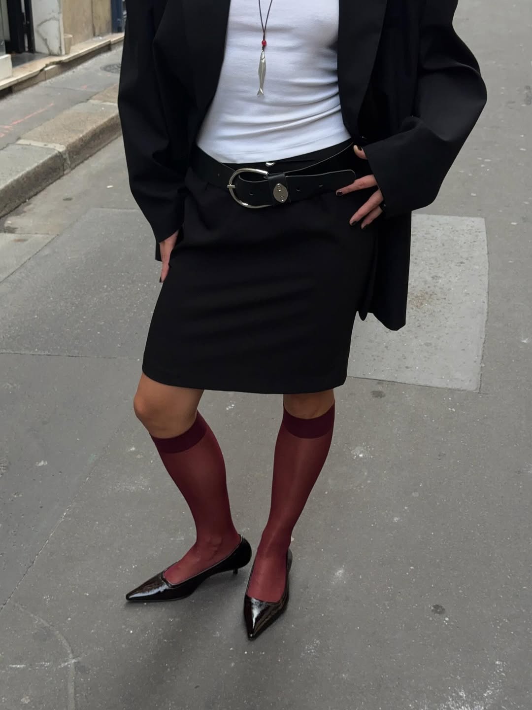 woman wearing black patent leather heels trend