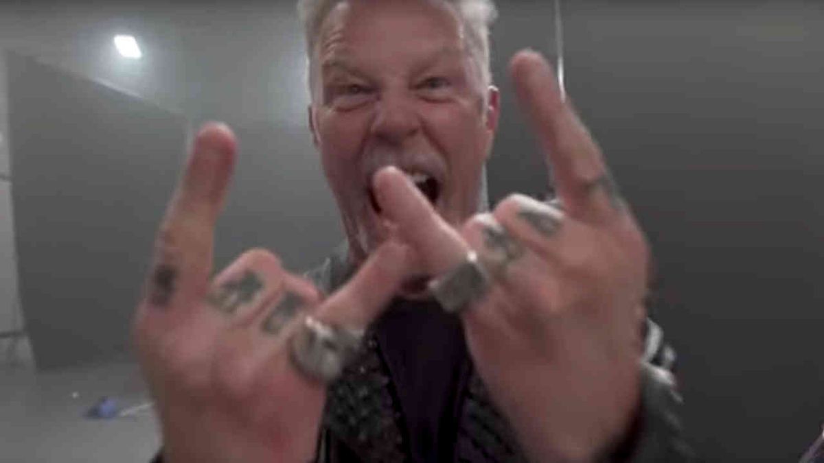 Metallica’s James Hetfield throwing the horns at the camera