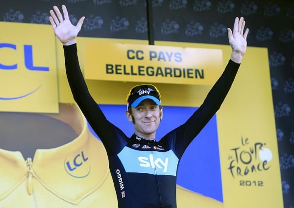 Bradley Wiggins (Sky) on the podium to receive the yellow jersey.