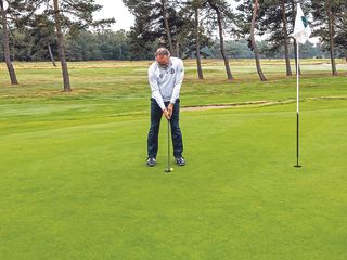 Golf Monthly Top 50 Coach Andy Gorman demonstrating a strong left-side column putting posture