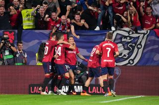 Osasuna players celebrate a goal against Barcelona in LaLiga in September 2023.