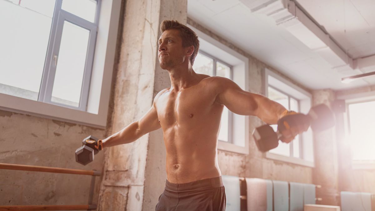 a man lifting dumbbells