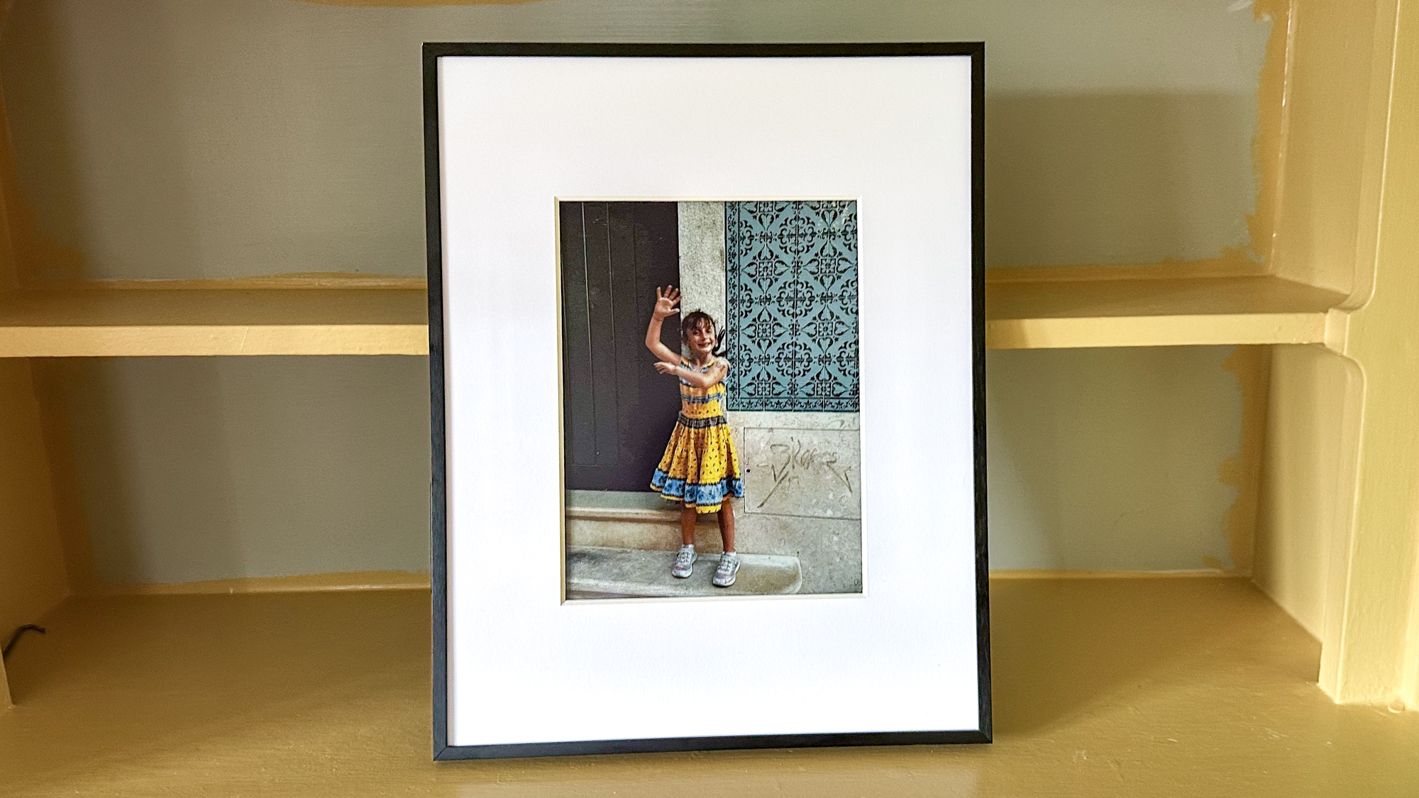 Aluratek ePaper 13.3 inch Wifi Digital Photo Frame on a shelf