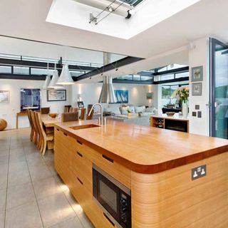 kitchen with white walls and wooden countertop