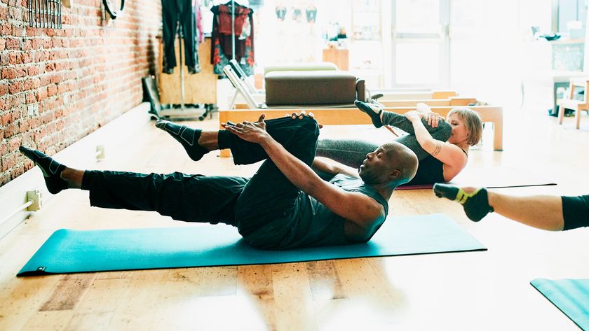 Man and woman in Pilates class