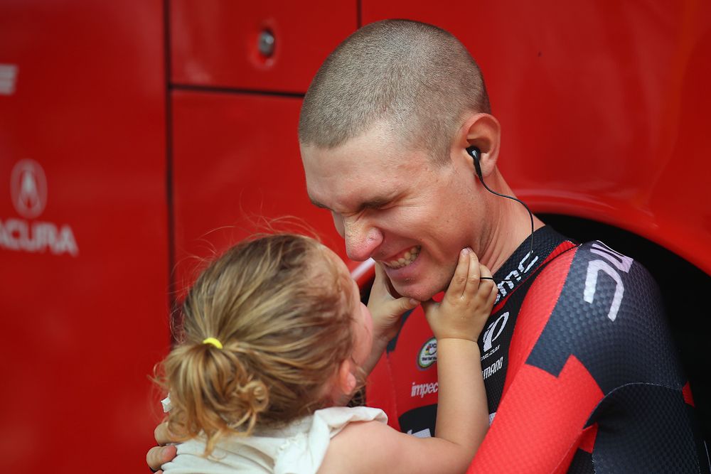 Tejay van Garderen plays with his daughter before the start of a stage at the 2015 Tour de France.