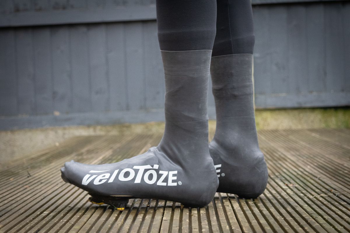 A rider wearing the Velotoze Latzex overshoes