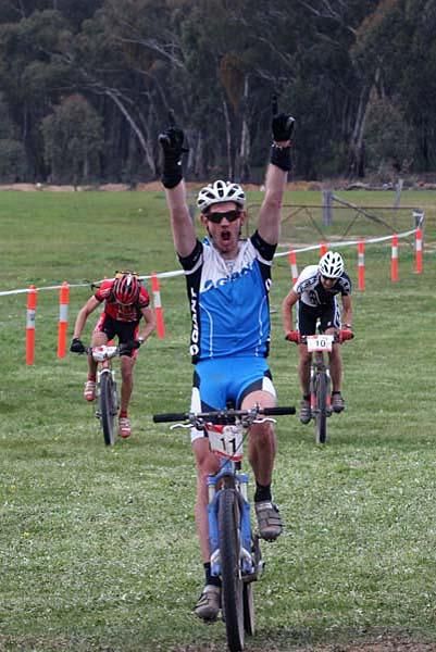 Ecstatic national marathon winner, Murray Spink leads Jason English and Neil Van der Ploeg in a sprint for the line.
