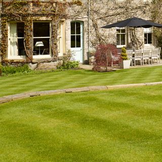 exterior of house showing freshly mowed lawn