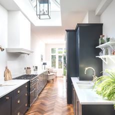 galley kitchen mistakes galley kitchen with herringbone wooden flooring and dark cabinetry