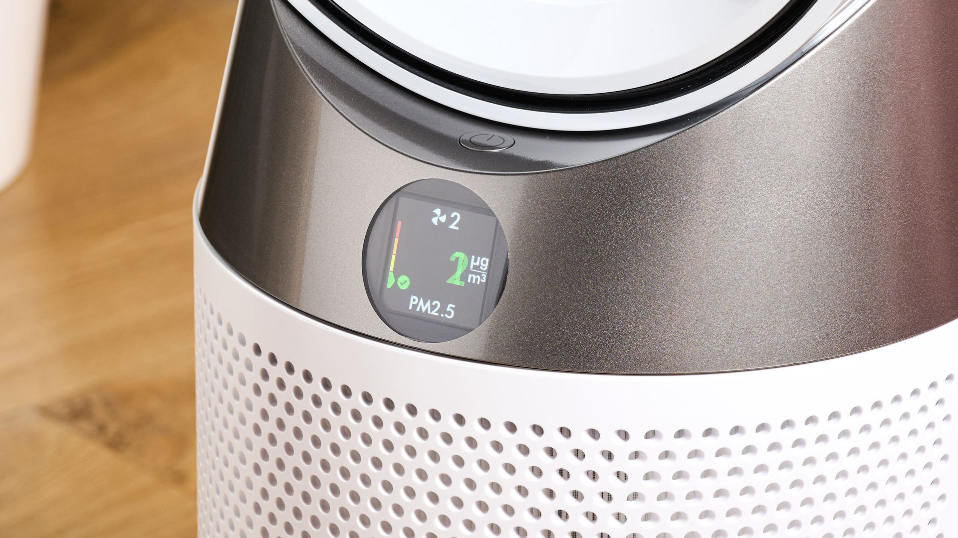 The circular screen of the Dyson HP10 is showing a reading of two micrograms of PM2.5 per cubic meter.