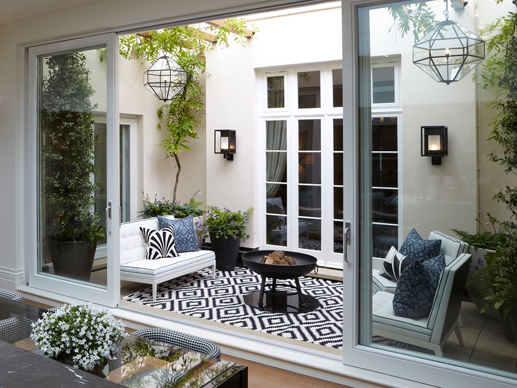 19 Courtyard garden ideas that maximise a small, paved outdoor space