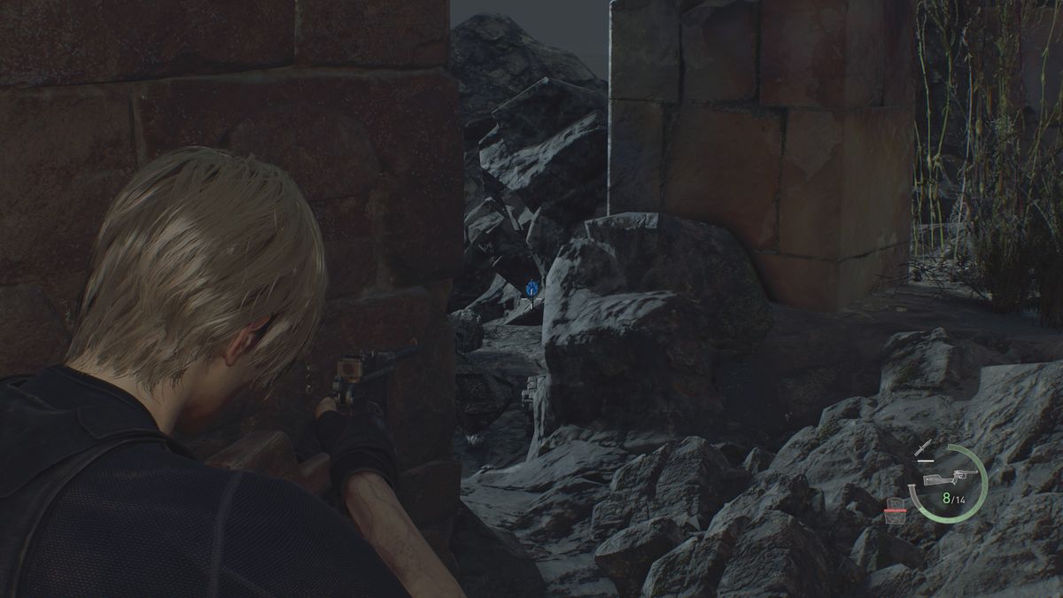 Resident Evil 4 Remake Blue Medallion inbetween some rocks