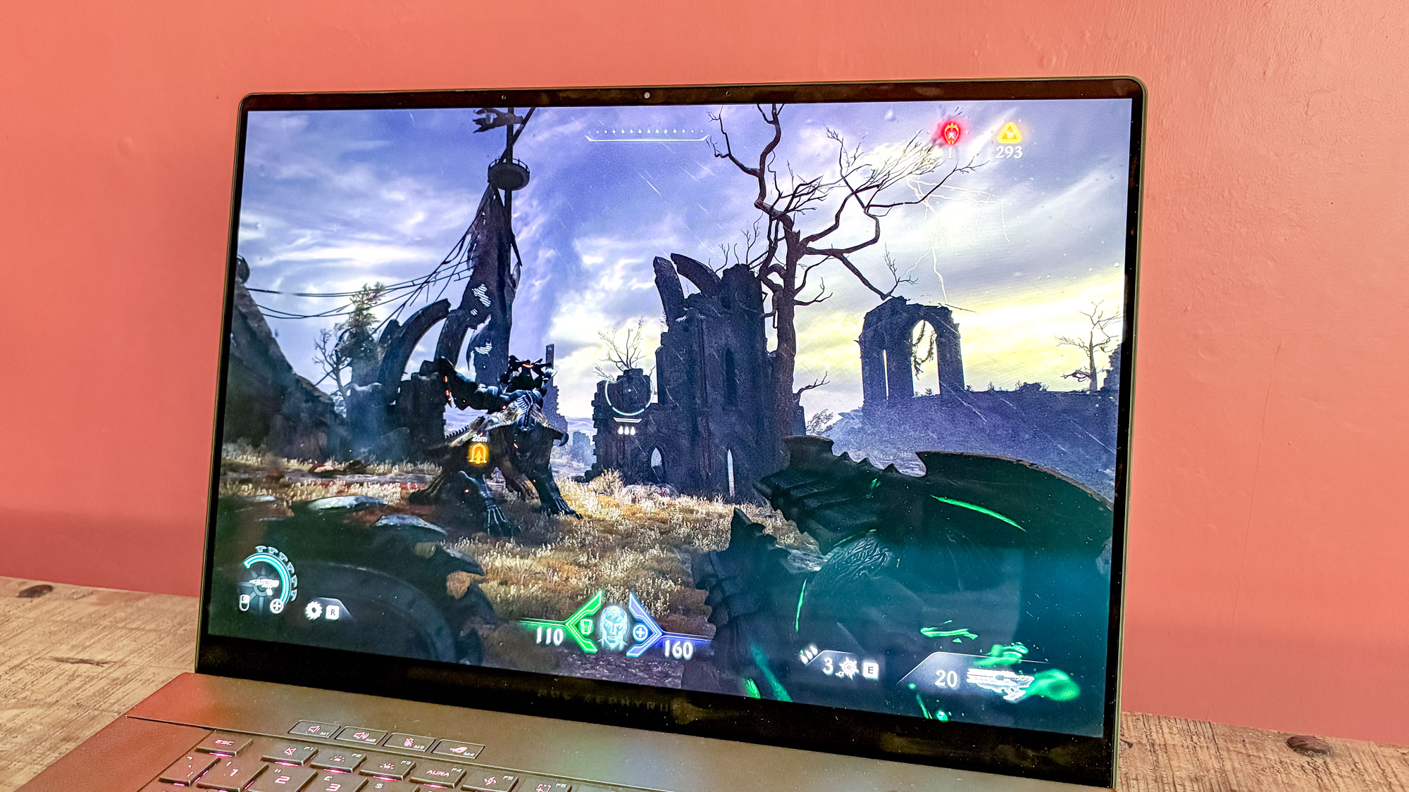 Asus ROG Zephyrus G16 on table with Doom: The Dark Ages on display