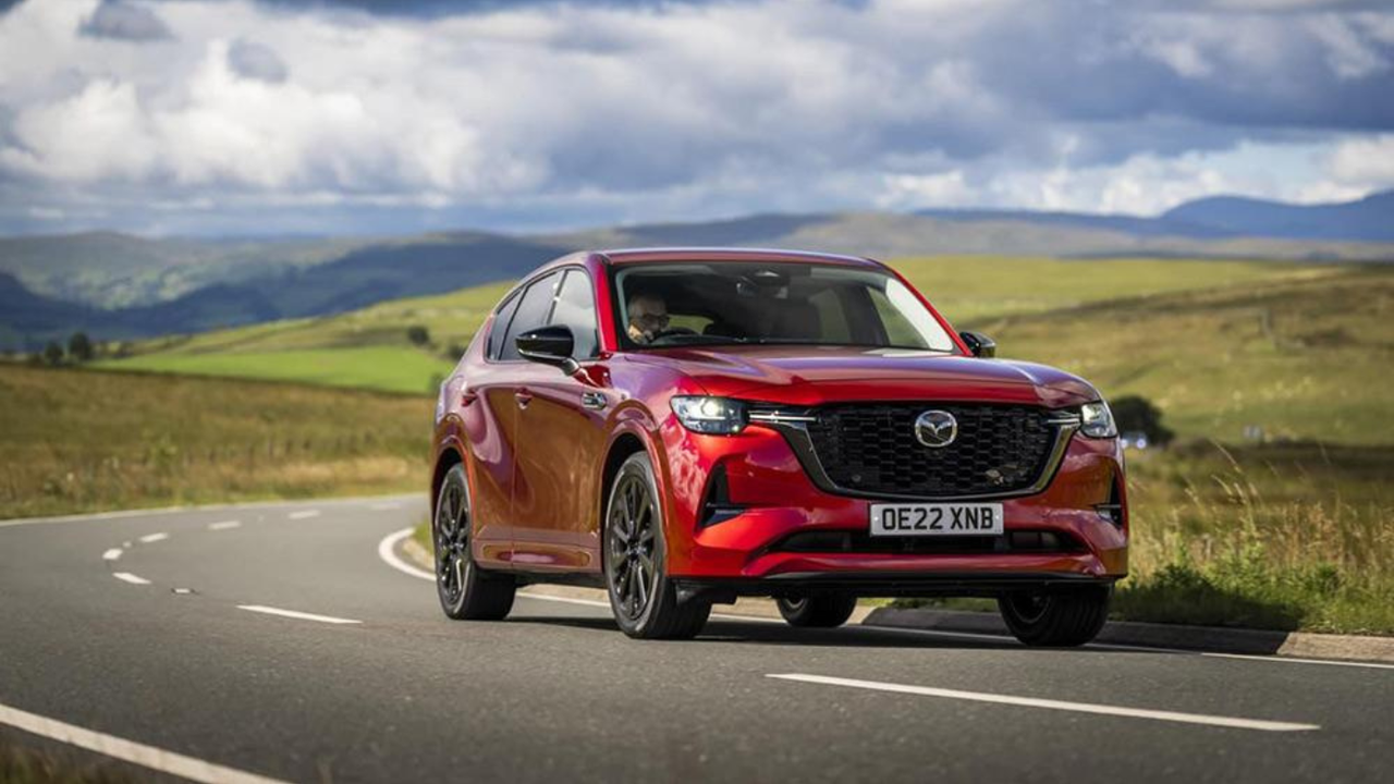 A red Mazda CX-60 on the road