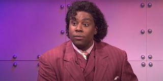 Kenan Thompson with a red suit on during a What Up With That sketch