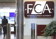 A logo sits on display in the headquarters of the Financial Conduct Authority (FCA) in the Canary Wharf business district in London