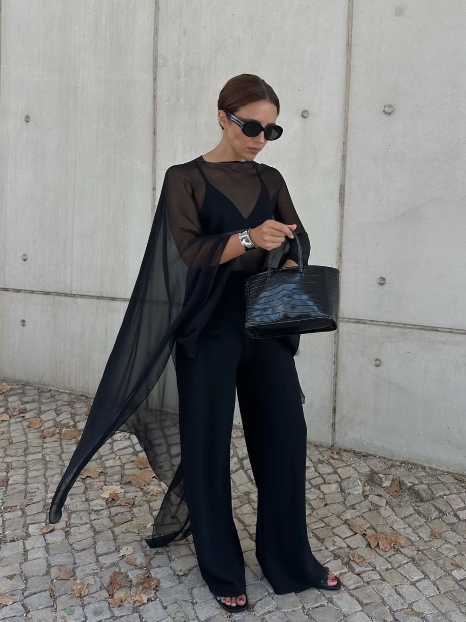 @deborabrosa Best Fashion Trends For Petites Autumn 2025 wearing a sheer cape and black trousers