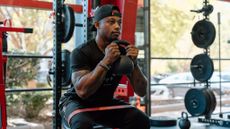 Man demonstrates kettlebell exercise in gym
