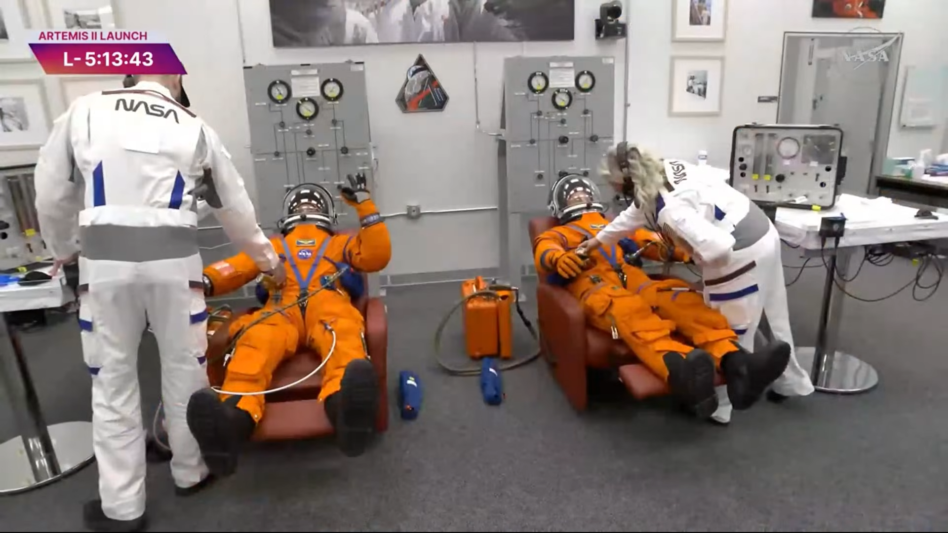Artemis astronauts getting their suits checked.