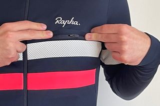 Image shows the zipped front pocket on the Rapha Brevet Long Sleeve Jersey.