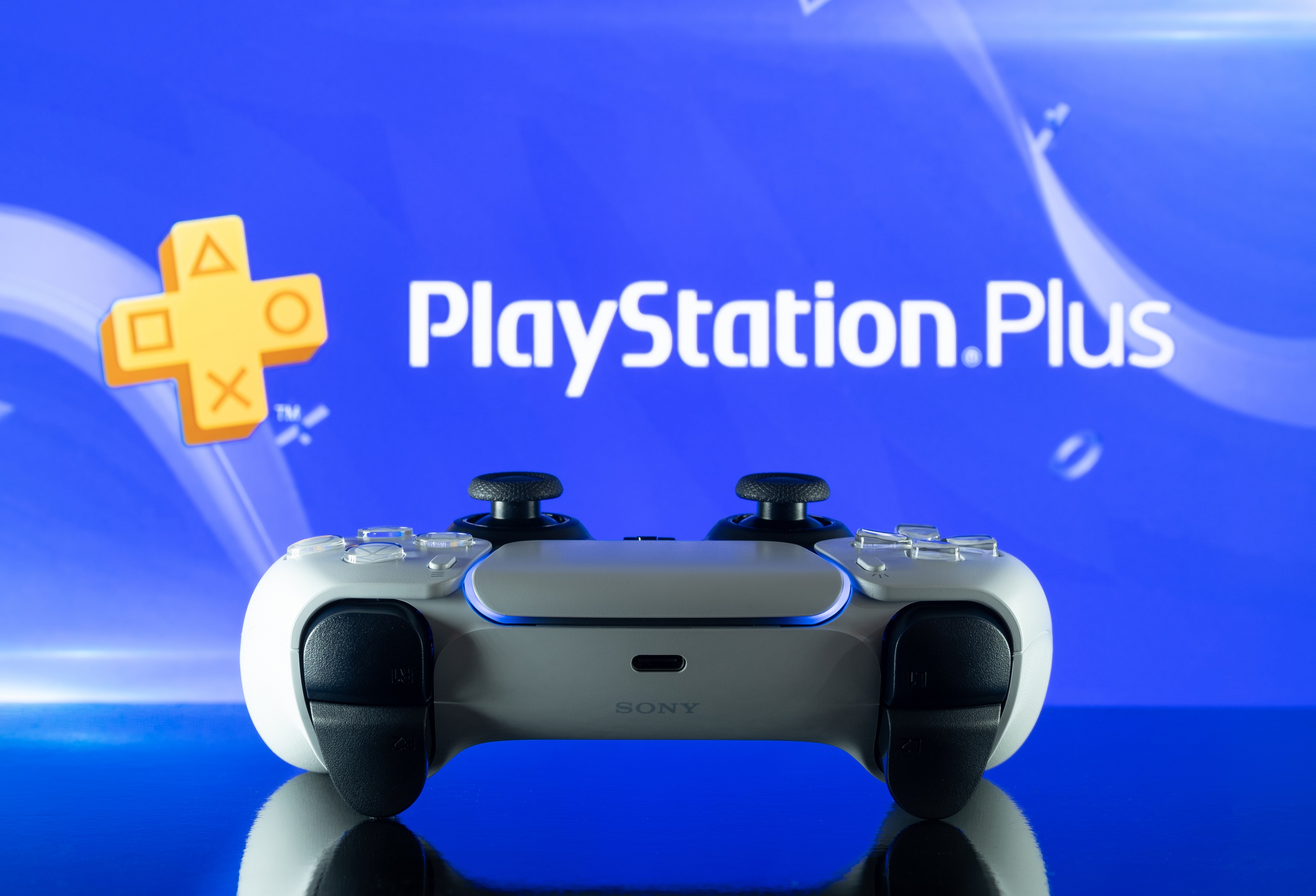 PS Plus logo with PS5 controller
