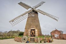 Berkswell Windmill is a feature in Jeanette McGarry’s garden in the West Midlands. Photo: Mark Williamson