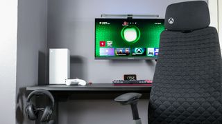 The Xbox Series X Digital Edition on a desk with Haworth's Xbox Fern chair in front