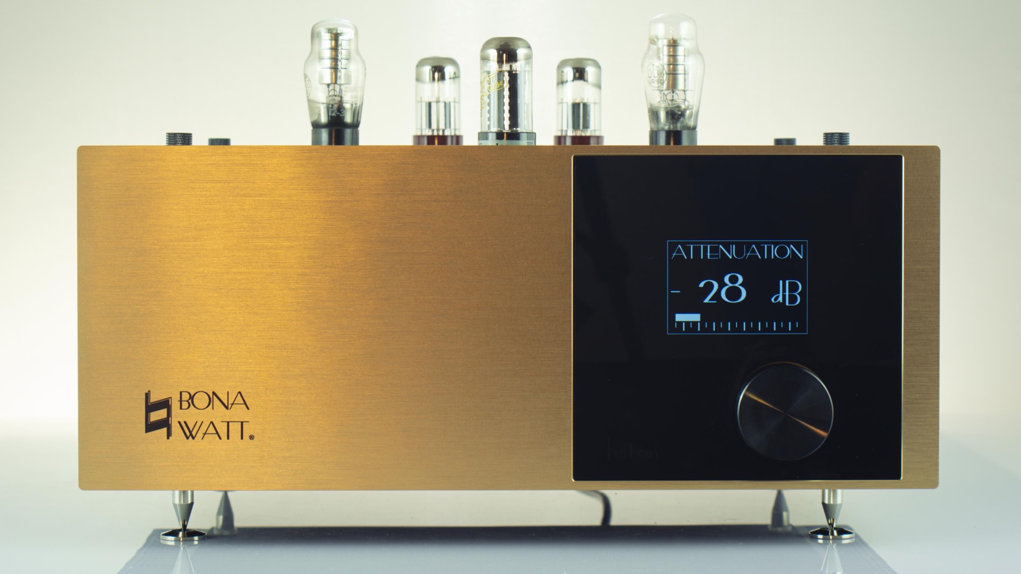 Bonawatt Triton valve amplifier in gold, photographed from the front on a neutral background. You can see five valve transistors on top.