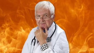 A doctor standing in front of a wall of fire