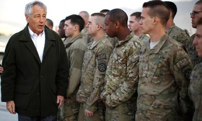 Secretary of Defense Chuck Hagel greets U.S. Army troops on the tarmac of Kabul airport on March 11.