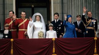 Princess Anne, Princess Royal and Mark Phillips wave from the balcony of Buckingham Palace following their wedding