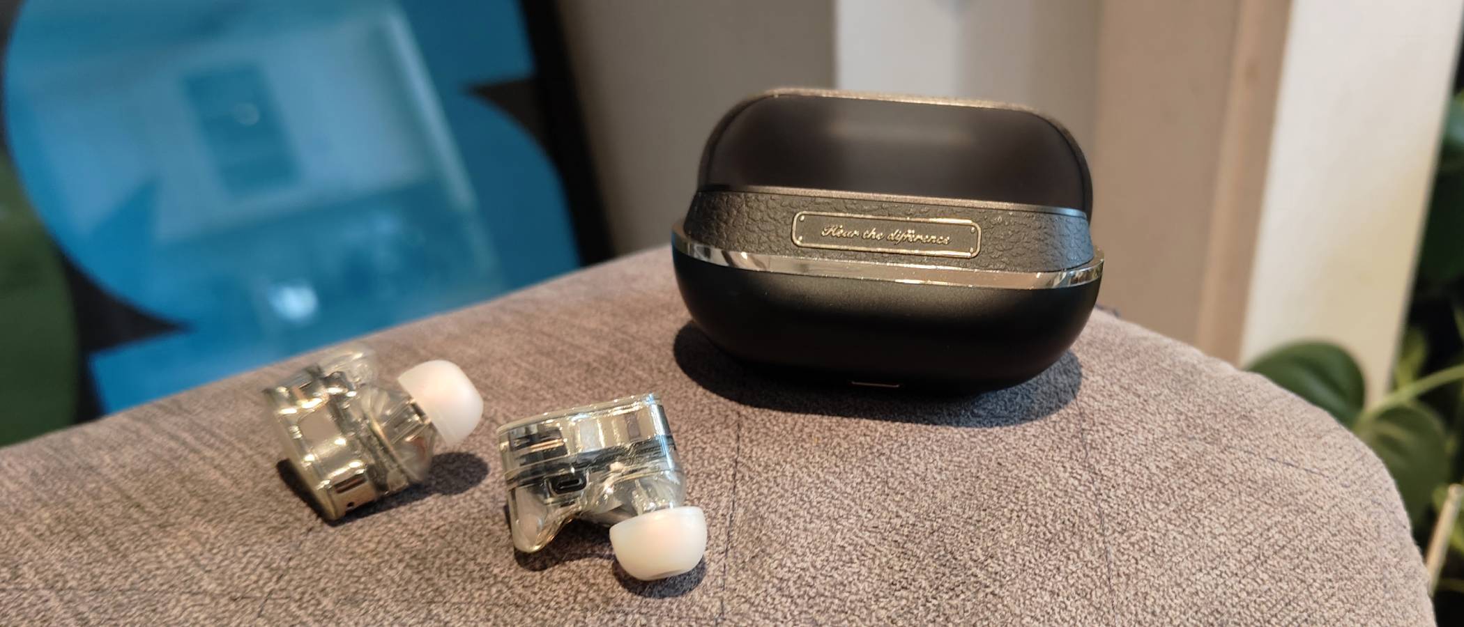 The Soundpeats H3 on the arm of a sofa.