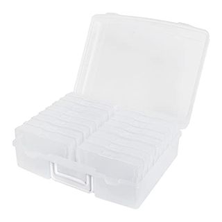 A white transulcent photo storage box with several inserts. 