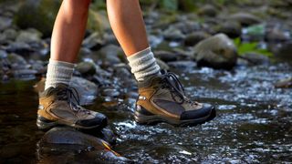 a photo of a woman wearing the best hiking boots