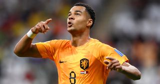 Cody Gakpo of Netherlands celebrates after scoring their team’s first goal during the FIFA World Cup Qatar 2022 Group A match between Netherlands and Qatar at Al Bayt Stadium on November 29, 2022 in Al Khor, Qatar.