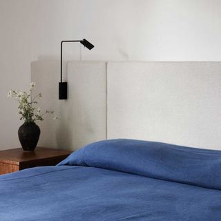 blue bedding in neutral bedroom