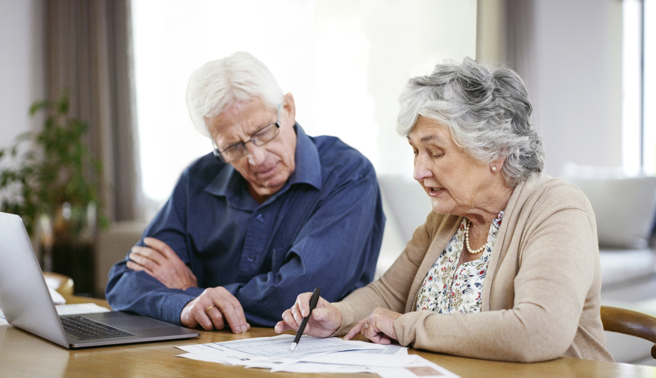 Retired couple working out their estate's inheritance tax liability