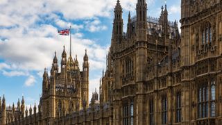 The Houses of Parliament with the Union Jack Flag, London, UK.