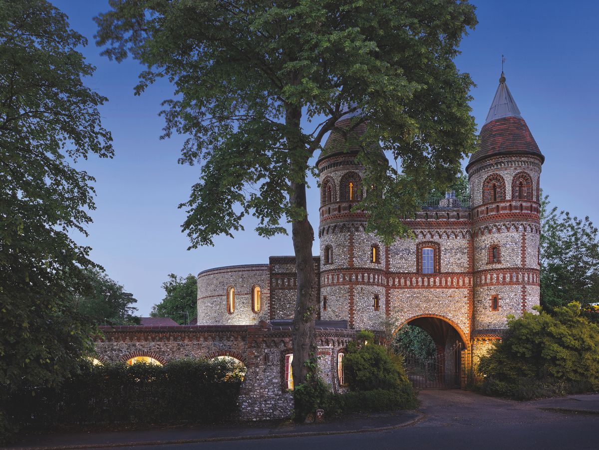 castle-like gate house built with flint and brick