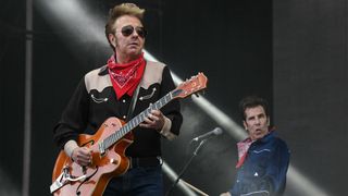 US singer and guitarist Brian Setzer (L) and US drummer Slim Jim Phantom, of the US band the Stray Cats, perform on stage during the 31st Eurockeennes rock music festival in Belfort, eastern France, on July 7, 2019.